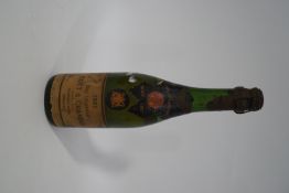 A 1921 Moet et Chandon half bottle of champagne, foil partially missing,