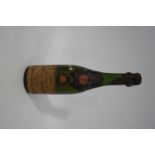 A 1921 Moet et Chandon half bottle of champagne, foil partially missing,