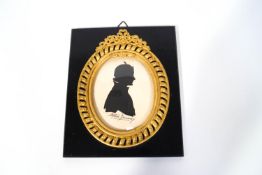 A 20th century silhouette of a Sybil Thorndike, signed indistinctly in pen,