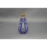 A pear shaped blue flash glass scent bottle, with an unmarked embossed hinged cover, 10.