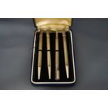 A set of four silver bridge pencils,