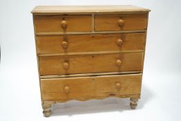 A Victorian pine chest of two short over three long drawers,
