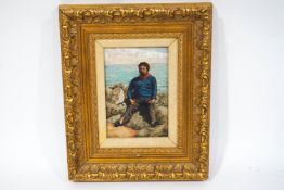 F Woodman, Figure seated on the rocks with sea beyond, Oil on canvas, Signed lower left, 18cm x 22.