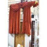 A pair of red and gold flower embroidered curtains with attached pelmet,