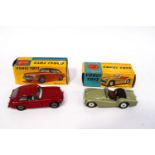 Two Corgi die-cast cars: 327 M.G.B. G.T, and a 305 Triumph T.R.