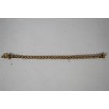 A 9 carat gold bracelet, of hollow links, 22 cm long; 8.