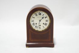 An Edwardian mahogany domed mantel clock with chiming eight day movement,