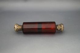 A red double ended scent bottle,