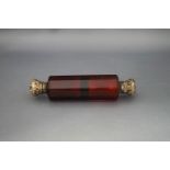 A red double ended scent bottle,