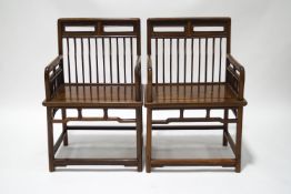 A pair of 19th century Chinese hardwood elbow chairs,