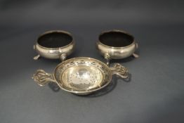 A pair of modern silver salts, in the cauldron style; and a silver tea strainer; 142 g (4.