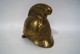A 19th century brass fireman's helmet