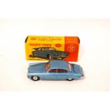A Dinky die-cast Jaguar Mark X, no 142, with luggage,