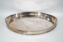 A large oval silver plated gallery tray, with cut out handles,