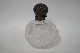 A Victorian cut glass spherical scent bottle with silver top, lacking stopper, 13.