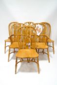 A set of six Windsor style wheelback double bow dining chairs,