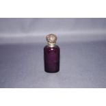 An amethyst glass scent bottle, with an unmarked embossed hinged cover, with stopper, 6.