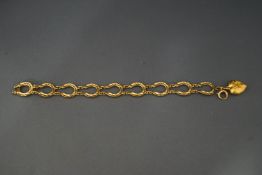 A 9 carat gold horseshoe link bracelet, 10.