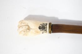 A silver collared walking stick,