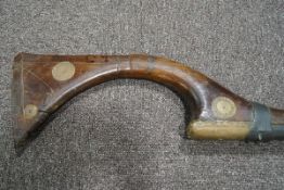 A Middle Eastern musket with brass inlay and mounts