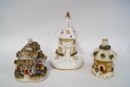 Three 19th century Staffordshire pastille burner cottages,