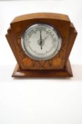 An Art Deco walnut mantel barometer, inlaid with flower decoration,
