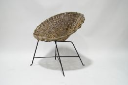 A modern wicker chair with metal frame,