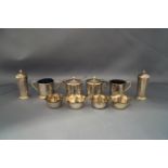 A six piece silver cruet set; with a four Victorian silver salts; a silver mustard spoon;