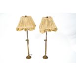 A pair of early 19th century brass table lamps with original pleated shades,