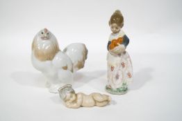 Three Lladro figures: a hen, 14cm high, a girl holding a basket of oranges, 17cm high,