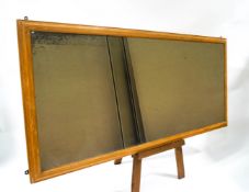 A large rectangular mirror in pine frame, 86.