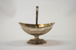 A Victorian silver swing handle sugar basket, by Charles Stuart Harris, London 1883,