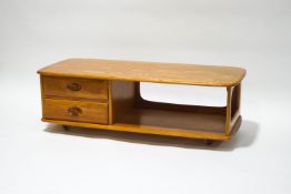 An Ercol blonde wood rectangular coffee table with two drawers, on casters,
