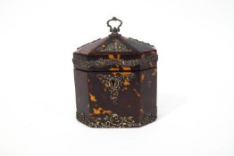 A George III tortoiseshell octagonal tea caddy, with later Victorian silver mounts,