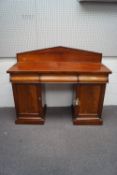 A Victorian mahogany pedestal sideboard, with three drawers over two cupboards,