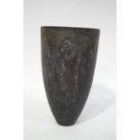 A bronze urn decorated with a Classical semi clad maiden to each side in relief,