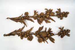 A pair of 19th century gilded gesso wall hangings in the form of festoons of fruit,