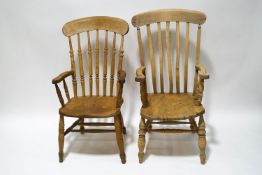 A pair of Country pine stick back kitchen chairs with elm seats,