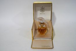A Nina Ricci 'L 'Air du Temps' scent bottle, designed by Lalique,