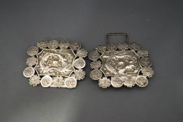 A Chinese two piece belt buckle, struck KW twice, probably for Kwan Wo, 11 cm across, 66 g (2.