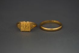 A 9 carat gold wedding ring; with a 9 carat gold signet ring; 3.