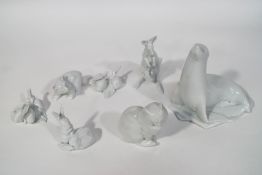Seven Herend figures: Sea Lion, Kangaroo, two Rabbits, Seated Cat, Walking Bear,