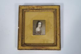 English school, early 19th century portrait miniature of a young girl wearing a brown dress,