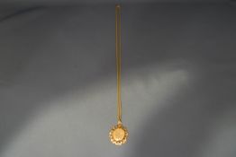 A 9 carat gold locket on chain, 3cm and 54 cm long respectively; 9.