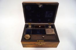 A Regency rosewood and brass inlaid ladies dressing case,