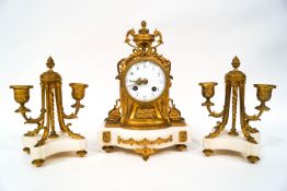 A late 19th century French gilt metal and marble clock garniture,