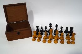 A turned wood chess set, boxed, King 7.