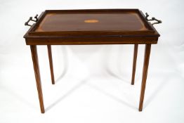 An Edwardian 'Osterley' inlaid mahogany table with brass handles, Osterley label to underside,