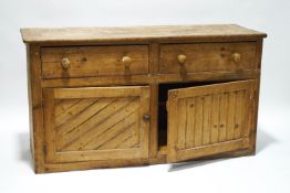 A Victorian pine dresser base, with two drawers and cupboards,