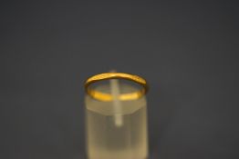 A 22 carat gold wedding ring,
